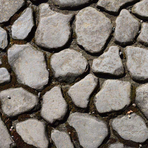 Close-up of an irregular cobblestone pavement