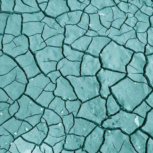 Textured pattern of cracked paint in shades of aqua
