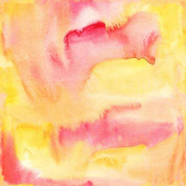 Abstract watercolor pattern with a blend of yellow and pink hues