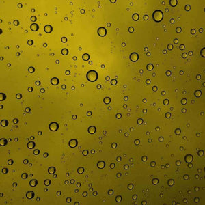 Water droplets on a golden surface