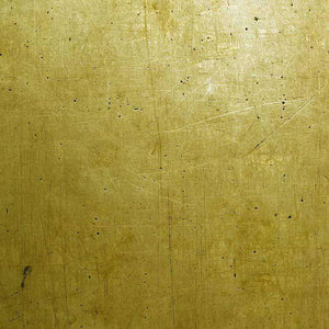 Aged gold leaf pattern with scratches and speckles
